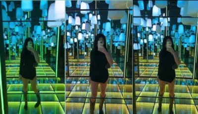 Praew Asian se olhando no espelho, toda poderosa